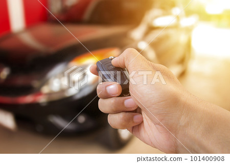 Men's hand presses on the remote control car 101400908