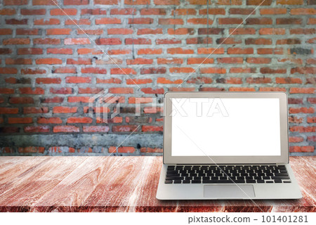 laptop on wooden shelves with brick wall background. laptop on wooden shelves with brick wall background. 101401281