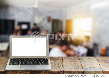 laptop on wooden shelves with blurred background. laptop on wooden shelves with blurred background. 101401282