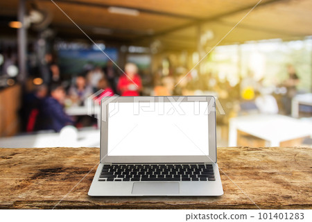 laptop on wooden shelves with blurred background. laptop on wooden shelves with blurred background. 101401283
