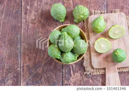 fresh bergamot and bergamot slice in wooden bowl fresh bergamot and bergamot slice in wooden bowl 101401346