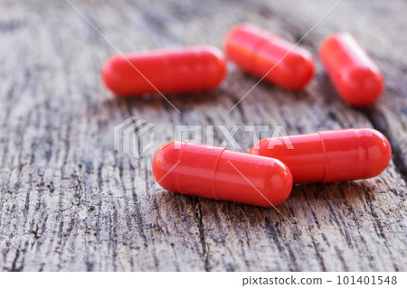 Close up pills on a wooden table. Close up pills on a wooden table. 101401548
