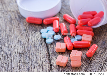 Close up pills on a wooden table. 101401551