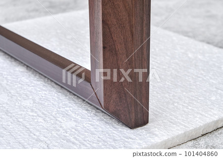 Wooden frame of bedside table made of solid walnut in workshop. Joinery angular joint of planks on dowels closeup Wooden frame of bedside table made of solid walnut in workshop. Joinery angular joint of planks on dowels closeup 101404860
