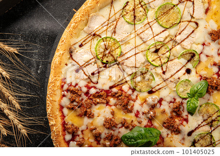 Big assorted pizza with variety of toppings Big assorted pizza with variety of toppings 101405025