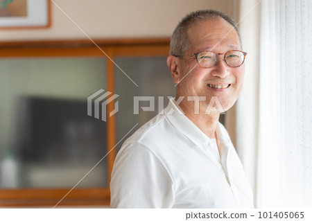 Smiling elderly man relaxing at home Smiling elderly man relaxing at home 101405065