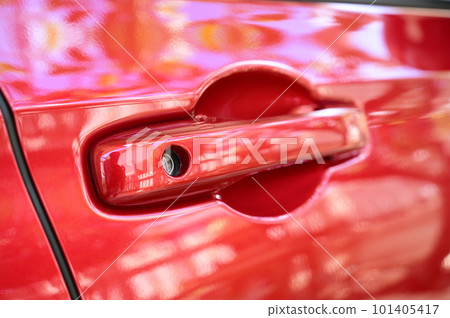 door handle of red car, transpotation industry 101405417