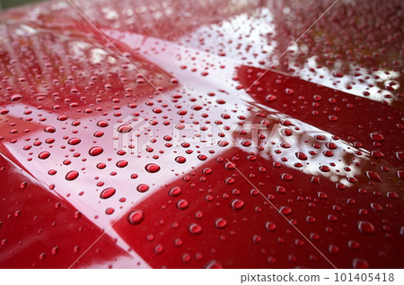 water on red hood car, transportation background 101405418