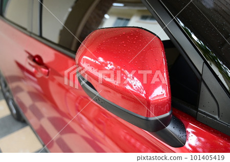 wing mirror of red car, transpotation industry 101405419