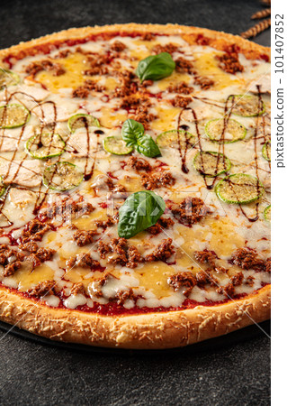 Big assorted pizza with variety of toppings Big assorted pizza with variety of toppings 101407852