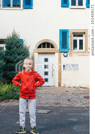 A little wriggles against the backdrop of a beautiful ancient historic building in Germany A little wriggles against the backdrop of a beautiful ancient historic building in Germany 101409171