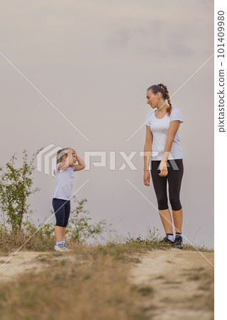 mother and daughter walking mother and daughter walking 101409980