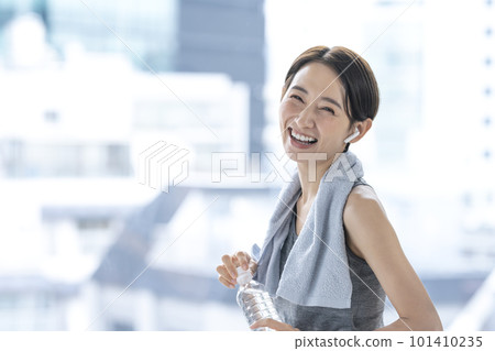 Woman resting after training hydration workout Woman resting after training hydration workout 101410235