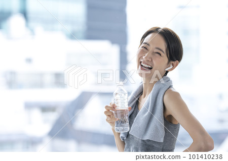 Woman resting after training hydration workout Woman resting after training hydration workout 101410238