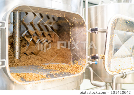 stainless steel boiler for brewing beer in a brewery. malt in the tank stainless steel boiler for brewing beer in a brewery. malt in the tank 101410642