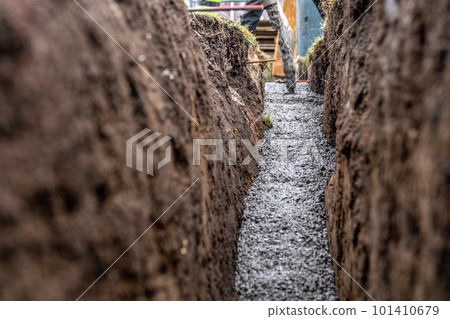 concrete in the ground for the foundation of the building 101410679