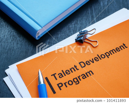 Talent development program, notepad and pen on the desk. Talent development program, notepad and pen on the desk. 101411893