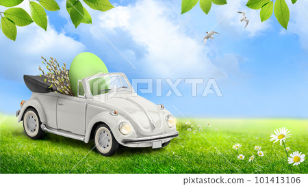 Retro toy car carrying an easter egg and willow branches 101413106