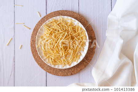 potato straw on white table flat lay 101413386