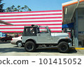 Gray Jeep Wrangler at Los Angeles Gas Station with American Flag in Background 101415052
