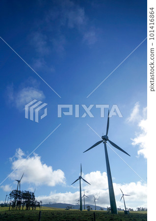 A wind turbine against the blue sky of the Atherton Tablelands 101416864