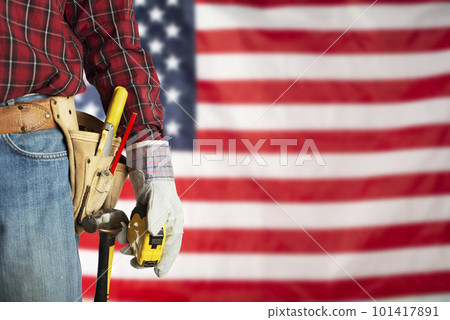 Laborer in gloves and toolbelt with measure on us flag background labor day mockup 101417891