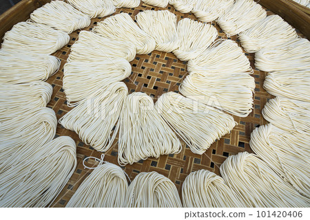 Close-up of traditional handmade noodle-making drying outdoors in Guanmiao, Tainan, Taiwan. 101420406