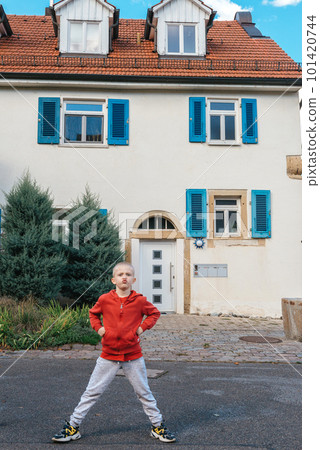 A little wriggles against the backdrop of a beautiful ancient historic building in Germany A little wriggles against the backdrop of a beautiful ancient historic building in Germany 101420744