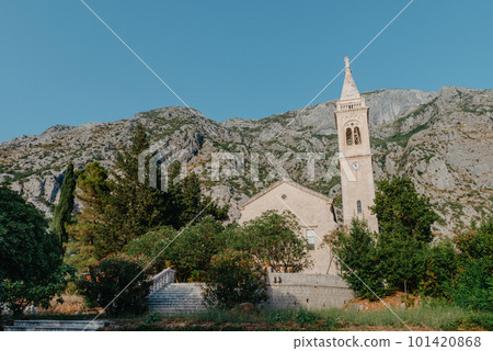 Beautiful view of the coast of Kotor Bay and St.Eustace's Church in the village Dobrota in Montenegro. Church of St. Eustachius is located in Dobrota , Kotor Montenegro. Beautiful view of the coast of Kotor Bay and St.Eustace's Church in the village Dobrota in Montenegro. Church of St. Eustachius is located in Dobrota , Kotor Montenegro. 101420868