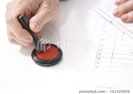 Woman's hand signing a real estate contract 101420956