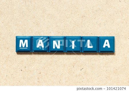 Tile alphabet letter in word manila on wood background 101421074