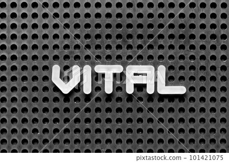 White alphabet letter in word vital on black pegboard background White alphabet letter in word vital on black pegboard background 101421075