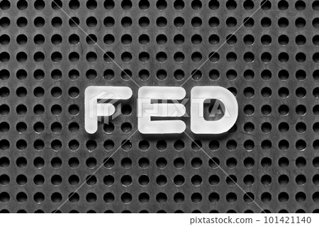 White alphabet letter in word fed on black pegboard background 101421140