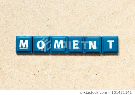 Tile alphabet letter in word moment on wood background 101421141
