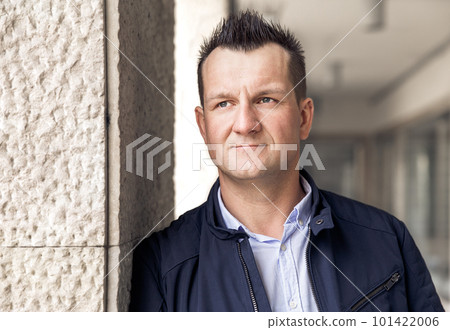 Confident business man standing in the city, looking and dreaming of future business success. Business vision. Leadership and successful conceptual strategy Confident business man standing in the city, looking and dreaming of future business success. Business vision. Leadership and successful conceptual strategy 101422006