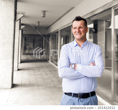 Confident business man standing in the city, looking and dreaming of future business success. Business vision. Leadership and successful conceptual strategy Confident business man standing in the city, looking and dreaming of future business success. Business vision. Leadership and successful conceptual strategy 101422012