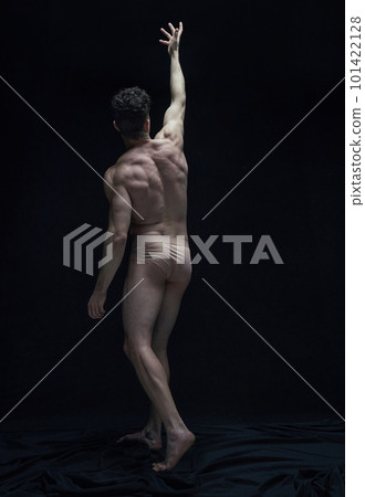 Relief body shape. Full-length portrait of handsome shirtless man posing in underwear against black studio background Relief body shape. Full-length portrait of handsome shirtless man posing in underwear against black studio background 101422128