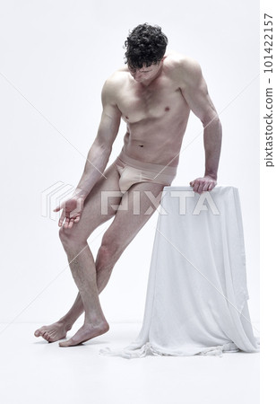 Full-length portrait of handsome man with muscular relief body posing shirtless in underwear against white studio background 101422157