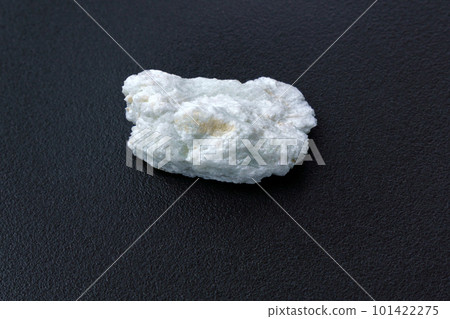 Albite crystal mineral, black background close up. Lepidolite 101422275