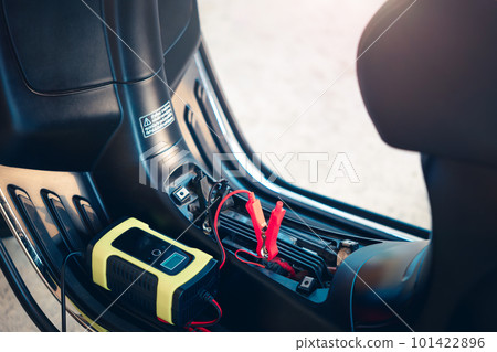 Charging battery in motorcycle for start. 101422896