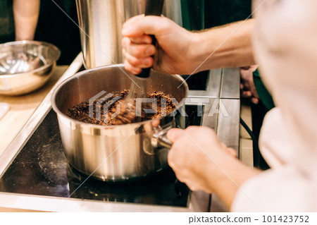 chef cooks mixture cream making dessert chocolate 101423752