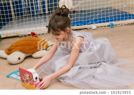 children girl play inside holiday beautiful dress 101423955