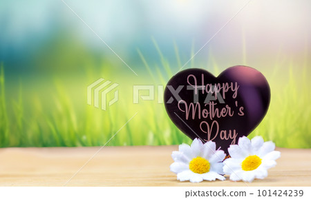 Happy mothers day card with bright bokeh fresh green grass background and white daisy flowers, Mothers Day theme, pink heart concept with copy space space for text 101424239