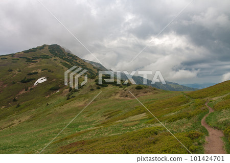 Mountain pass Bublen, path to Maly Krivan, national park Mala Fatra, Slovakia, in spring cloudy day 101424701