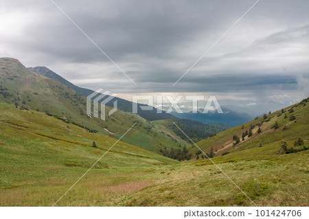Valley under Maly Krivan, view from mountain pass Bublen, national park Mala Fatra, Slovakia, spring cloudy day. 101424706
