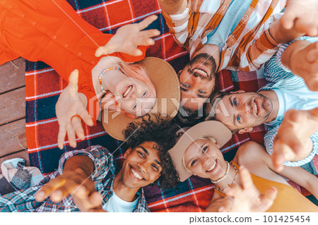 Group of friend relax together lying down in summer Group of friend relax together lying down in summer 101425454