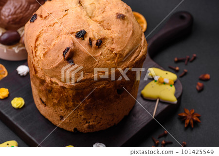 Easter cake or panettone with raisins and candied fruits Easter cake or panettone with raisins and candied fruits 101425549