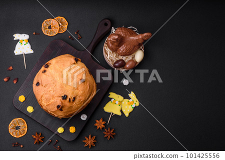 Easter cake or panettone with raisins and candied fruits Easter cake or panettone with raisins and candied fruits 101425556
