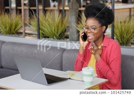 African American female student is watching online training webinar, education and work on Internet 101425749