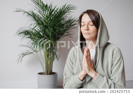 yoga and meditation, young woman with closed eyes and hands in namaste yoga and meditation, young woman with closed eyes and hands in namaste 101425753